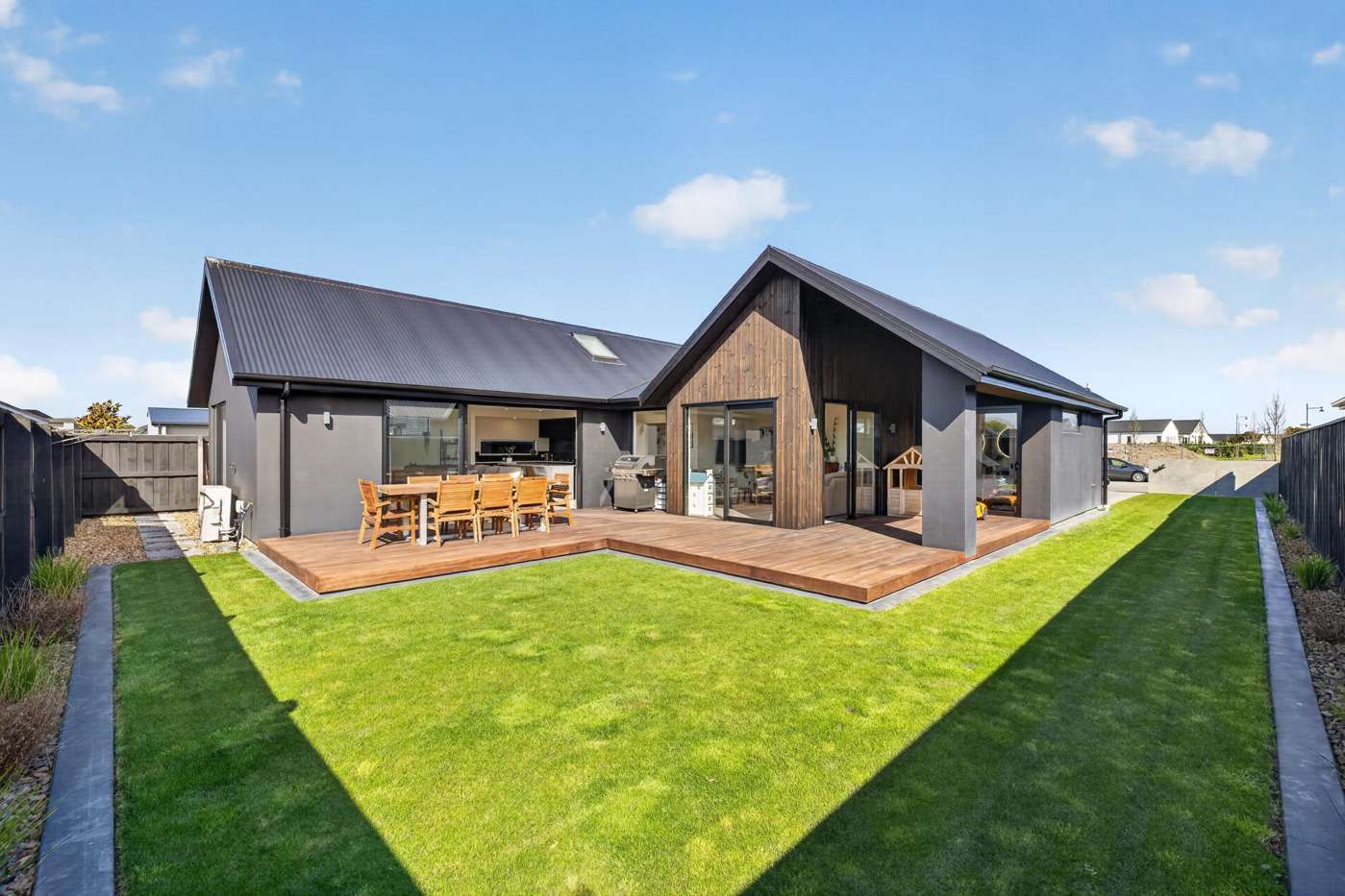 Landscaped lawn and outdoor living at 20 Mills Road