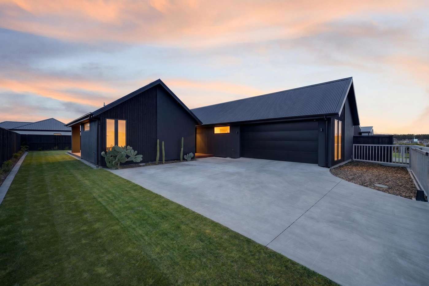 Front exterior of 20 Mills Road at sunset
